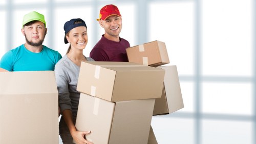 Sorted recyclable materials and charity-donated items in a Surrey removals service
