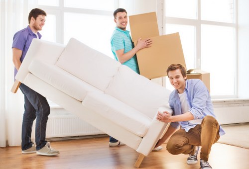 Packed boxes and furniture loaded into a local moving van