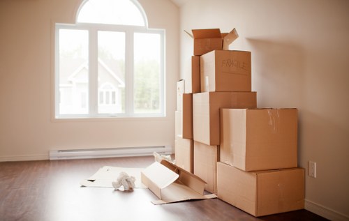 Moving team preparing a Surrey home relocation with boxes and furniture