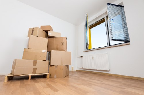 Careful loading of boxes and furniture into a removal van in Surrey