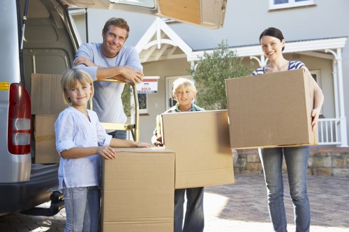 Packed boxes and furniture ready for removal in Surrey