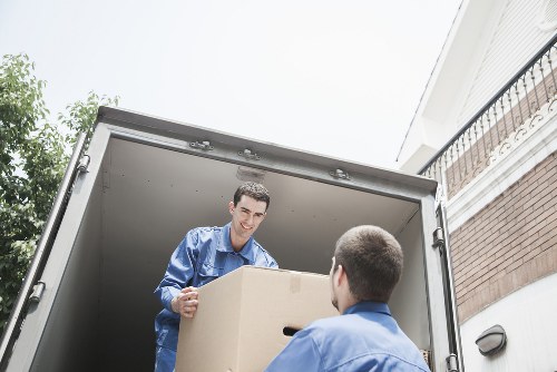 Team handling desks and filing cabinets for a Surrey business relocation
