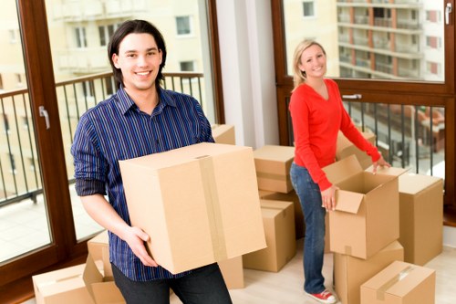 Removal team handling furniture and boxes during a Surrey house move